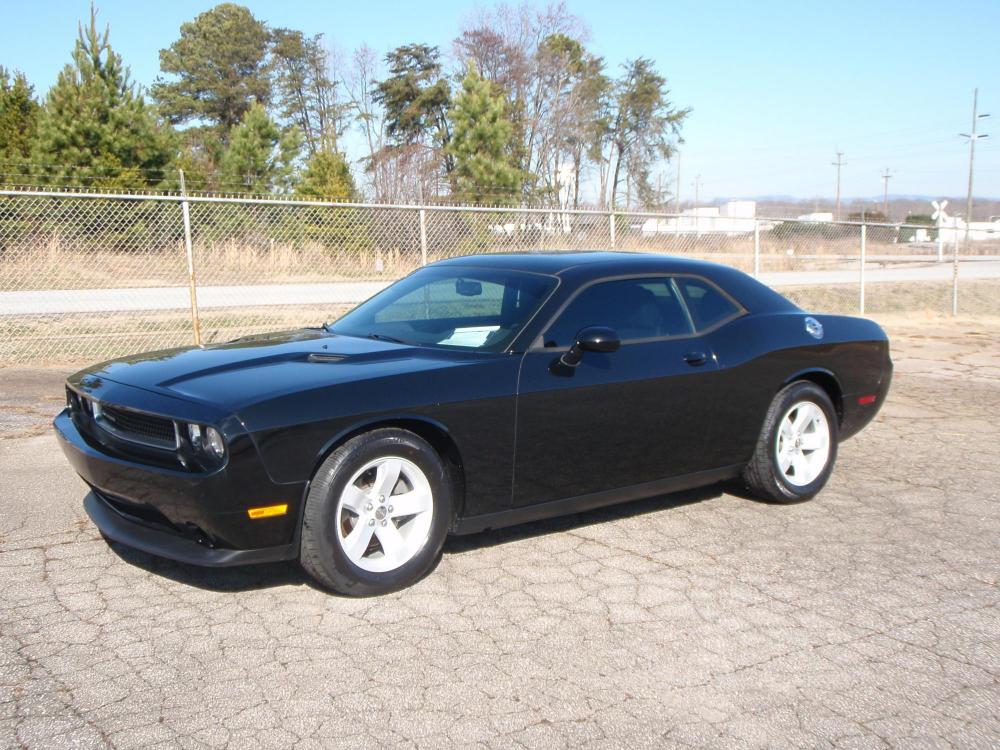 2013 BLACK /BLACK Dodge Challenger SXT (2C3CDYAG5DH) with an 3.6L V6 DOHC 24V engine, 4-Speed Automatic transmission, located at 2812 White Horse Road, Greenville, SC, 29611, (864) 269-1711, 34.808655, -82.434776 - NEW SET OF TIRES!!! 3.6 LITER V6 ENGINE,18 INCH ALLOY WHEELS,ANTI LOCK BRAKES,ANTI THEFT SYSTEM,TILT/REACH STEERING,A/C ,2 ZONE CLIMATE CONTROL,DUAL AIRBAGS,FRONT/REAR SIDE AIRBAGS,BODY COLOR BUMPERS,MIRRORS,AND DOOR HANDLES,CRUISE CONTROL,USB/AUX OUTLET,VANITY MIRRORS,TRACTION CONTROL,POWER MIRRORS - Photo #0