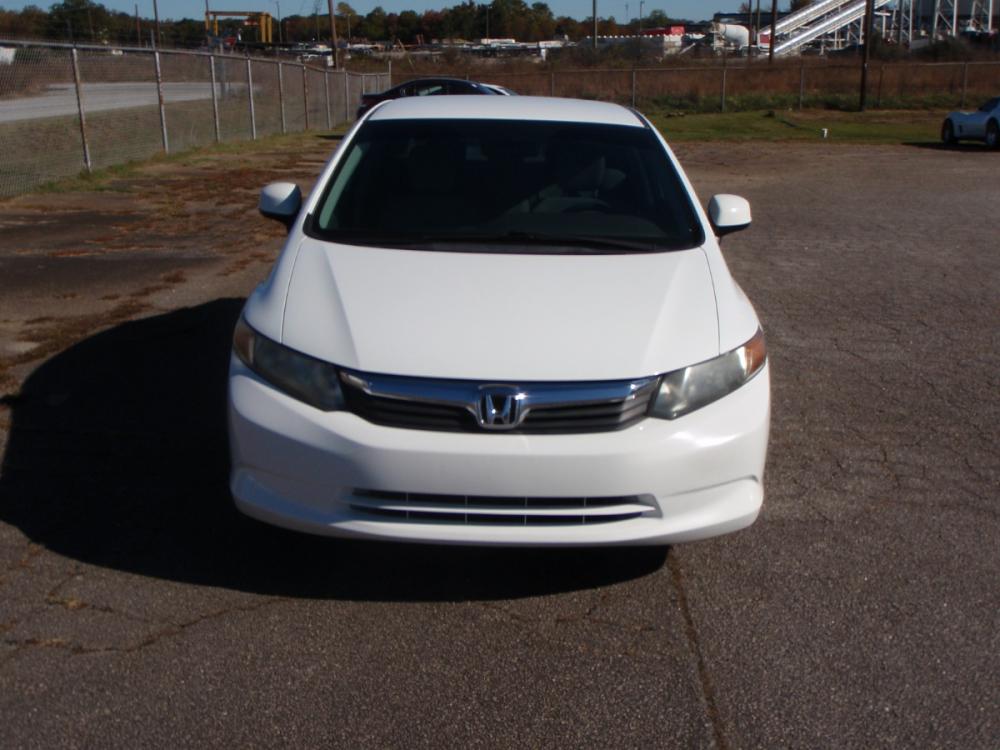 2012 WHITE /GRAY Honda Civic LX Sedan 5-Speed AT (2HGFB2F52CH) with an 1.8L L4 SOHC 16V engine, 5-Speed Automatic transmission, located at 2812 White Horse Road, Greenville, SC, 29611, (864) 269-1711, 34.808655, -82.434776 - 1.8 LITER 4 CYLINDER ENGINE, 15 INCH WHEELS,ANTI LOCK BRAKES, ANTI THEFT SYSTEM,TILT/REACH STEERING, A/C,DUAL AIRBAGS,FRONT/REAR SIDE AIRBAGS,BODY COLOR BUMPERS,MIRRORS,AND DOOR HANDLES,CRUISE CONTROL,USB/AUX OUTLER,VANITY MIRRORS,TRACTION CONTROL,ECO MODE,POWER MIRRORS,WINDOWNS,AND DOOR LOCKS,REAR - Photo #2