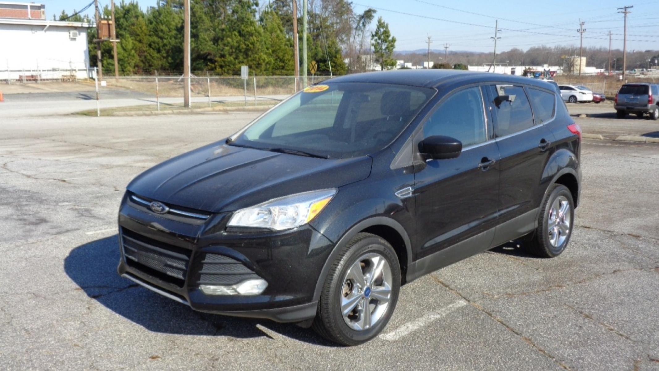 2014 BLACK /TAN Ford Escape SE 4WD (1FMCU9GX0EU) with an 1.6L L4 DOHC 16V engine, 6-Speed Automatic transmission, located at 2812 White Horse Road, Greenville, SC, 29611, (864) 269-1711, 34.808655, -82.434776 - Photo #0