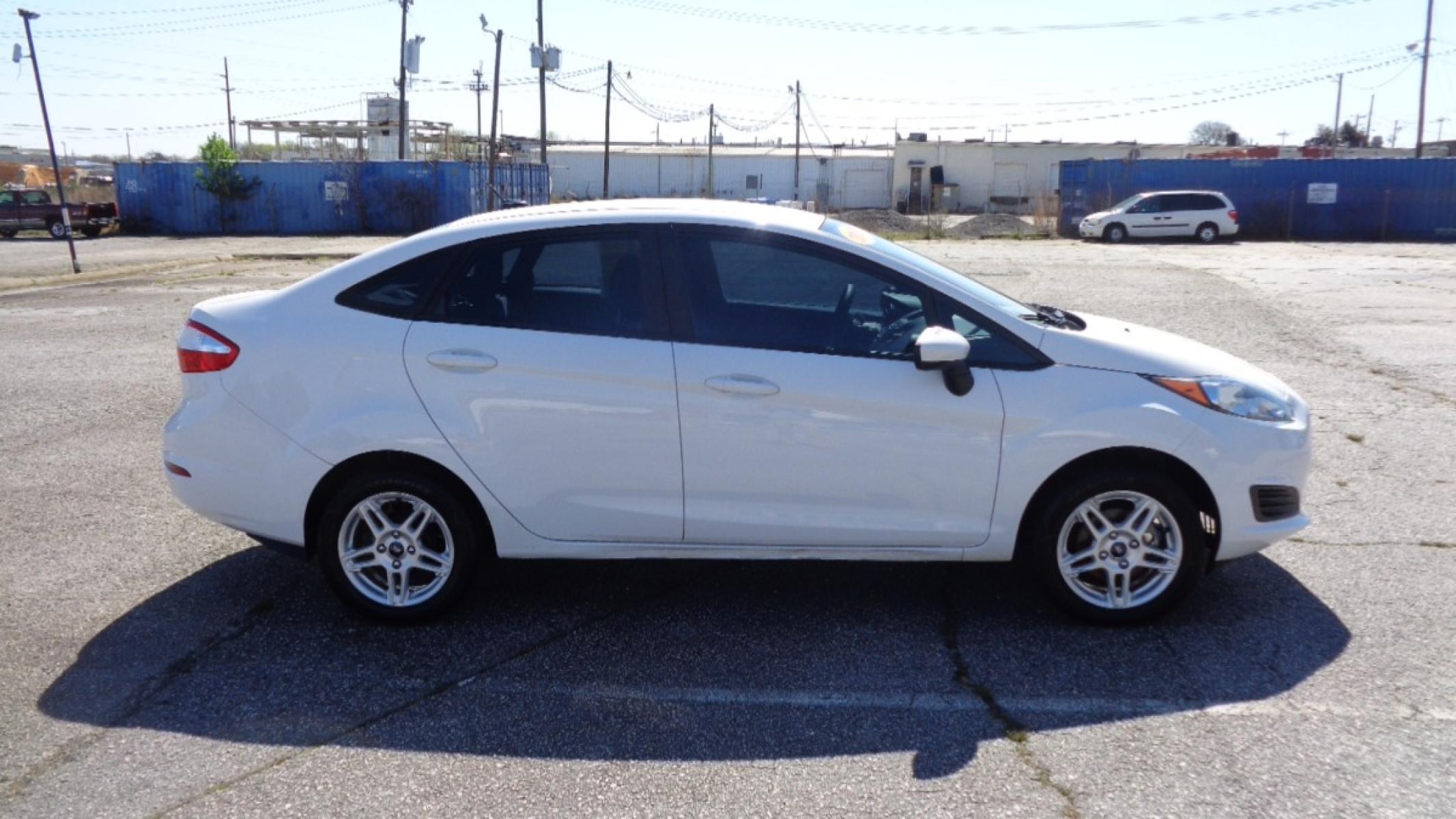 2017 WHITE /TAN Ford Fiesta SE Sedan (3FADP4BJ1HM) with an 1.6L L4 DOHC 16V engine, AUTOMATIC transmission, located at 2812 White Horse Road, Greenville, SC, 29611, (864) 269-1711, 34.808655, -82.434776 - 1.6 LITER 4 CYLINDER ENGINE,15 INCH ALLOY WHEELS,ANTI LOCK BRAKES,ANTI THEFT SYSTEM,TILT/REACH STEERING,A/C,DUAL AIRBAGS,FRONT SIDE AIRBAGS,BODY COLOR BUMPERS,AND DOOR HANDLES,BLACK MIRRORS,CRUISE CONTROL,AUOTMAITC HEADLIGHTS,USB/AUX OUTLET,VANITY MIRRORS,POWER MIRRORS,WINDOWS,AND DOOR LOCKS,REAR DE - Photo #2