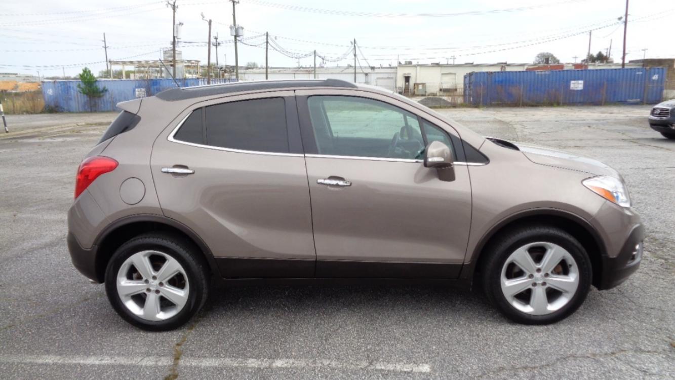 2015 SANDY BROWN /BLACK Buick Encore Premium AWD (KL4CJHSB8FB) with an 1.4L L4 DOHC 16V TURBO engine, 6-Speed Automatic transmission, located at 2812 White Horse Road, Greenville, SC, 29611, (864) 269-1711, 34.808655, -82.434776 - 1.4 LITER 4 CYLINDER TURBO,ALL WHEEL DRIVE,18 INCH ALLOY WHEELS,ANTI LOCK BRAKES,ANTI THEFT SYSTEM,TILT/REACH STEERING,A/C,2 ZONE A/C CLIMATE CONTROL,FRONT SIDE AIRBAGS,BODY COLOR BUMPERS,MIRRORS AND DOOR HANDLES,CRUISE CONTROL,FOG LIGHTS,AUTOMATIC HEADLIGHTS,USB/AUX OUTLET,LIT VANITY MIRRORS, POWER - Photo #2