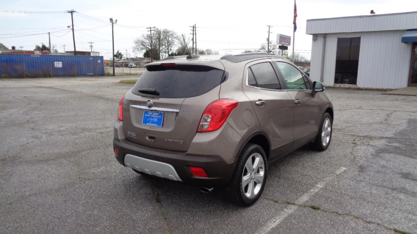 2015 SANDY BROWN /BLACK Buick Encore Premium AWD (KL4CJHSB8FB) with an 1.4L L4 DOHC 16V TURBO engine, 6-Speed Automatic transmission, located at 2812 White Horse Road, Greenville, SC, 29611, (864) 269-1711, 34.808655, -82.434776 - 1.4 LITER 4 CYLINDER TURBO,ALL WHEEL DRIVE,18 INCH ALLOY WHEELS,ANTI LOCK BRAKES,ANTI THEFT SYSTEM,TILT/REACH STEERING,A/C,2 ZONE A/C CLIMATE CONTROL,FRONT SIDE AIRBAGS,BODY COLOR BUMPERS,MIRRORS AND DOOR HANDLES,CRUISE CONTROL,FOG LIGHTS,AUTOMATIC HEADLIGHTS,USB/AUX OUTLET,LIT VANITY MIRRORS, POWER - Photo #3