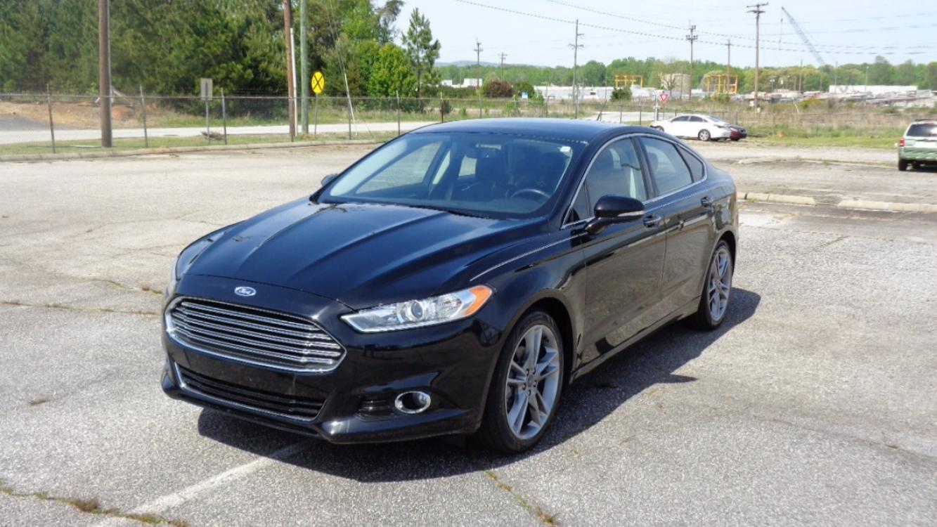 2016 BLACK /BLACK Ford Fusion Titanium (3FA6P0K99GR) with an 2.0L L4 DOHC 16V engine, 6-Speed Automatic transmission, located at 2812 White Horse Road, Greenville, SC, 29611, (864) 269-1711, 34.808655, -82.434776 - 3.6 LITER V6 ENGINE, 22 INCH BLACK RIMS W/ NEW SET OF TIRES,ANTI LOCK BRAKES,TILT/REACH STEERING,A/C,DUAL AIRBAGS,FRONT SIDE AIRBAGS,BODY COLOR BUMPERS,MIRRORS,AND DOOR HANDLES,CRUISE CONTROL, FOG LIGHTS ,AUTOMATIC HEADLIGHTS,USB/AUX OUTLET,VANITY MIRRORS,TRACTION COTNROL,POWER MIRRORS,WINDOWS,AND D - Photo #0
