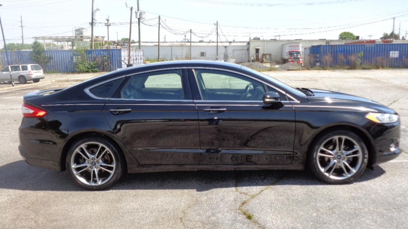 2016 BLACK /BLACK Ford Fusion Titanium (3FA6P0K99GR) with an 2.0L L4 DOHC 16V engine, 6-Speed Automatic transmission, located at 2812 White Horse Road, Greenville, SC, 29611, (864) 269-1711, 34.808655, -82.434776 - Photo #2