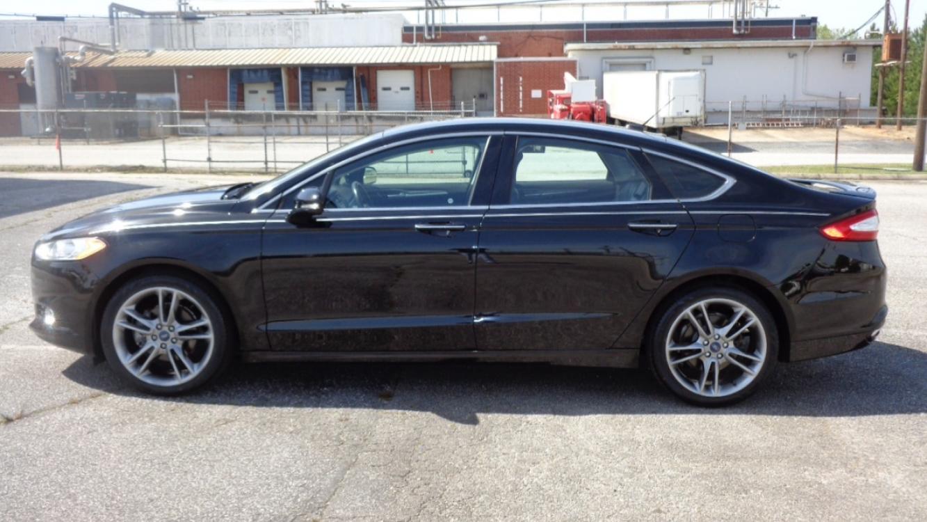 2016 BLACK /BLACK Ford Fusion Titanium (3FA6P0K99GR) with an 2.0L L4 DOHC 16V engine, 6-Speed Automatic transmission, located at 2812 White Horse Road, Greenville, SC, 29611, (864) 269-1711, 34.808655, -82.434776 - 3.6 LITER V6 ENGINE, 22 INCH BLACK RIMS W/ NEW SET OF TIRES,ANTI LOCK BRAKES,TILT/REACH STEERING,A/C,DUAL AIRBAGS,FRONT SIDE AIRBAGS,BODY COLOR BUMPERS,MIRRORS,AND DOOR HANDLES,CRUISE CONTROL, FOG LIGHTS ,AUTOMATIC HEADLIGHTS,USB/AUX OUTLET,VANITY MIRRORS,TRACTION COTNROL,POWER MIRRORS,WINDOWS,AND D - Photo #5